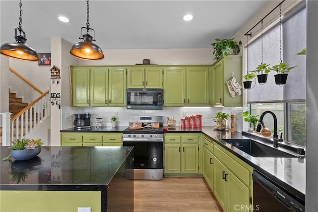 13126 Glandt Ct, Corona, CA 92883 - kitchen with black appliances, light wood-style floors, green cabinetry, pendant lighting, and a sink