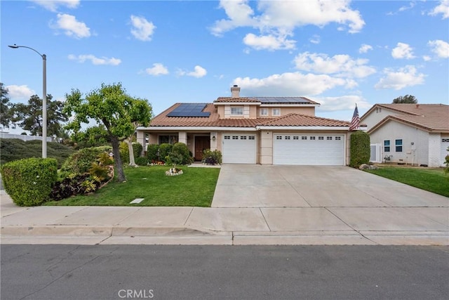 13126 Glandt Ct, Corona, CA 92883 - view of front of property featuring a front yard, solar panels, an attached garage, a tile roof, and driveway