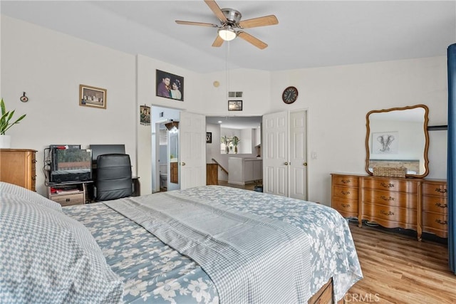 13126 Glandt Ct, Corona, CA 92883 - bedroom with light wood-type flooring and vaulted ceiling