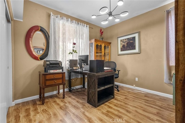 13126 Glandt Ct, Corona, CA 92883 - office area featuring a notable chandelier, light wood-style floors, and baseboards