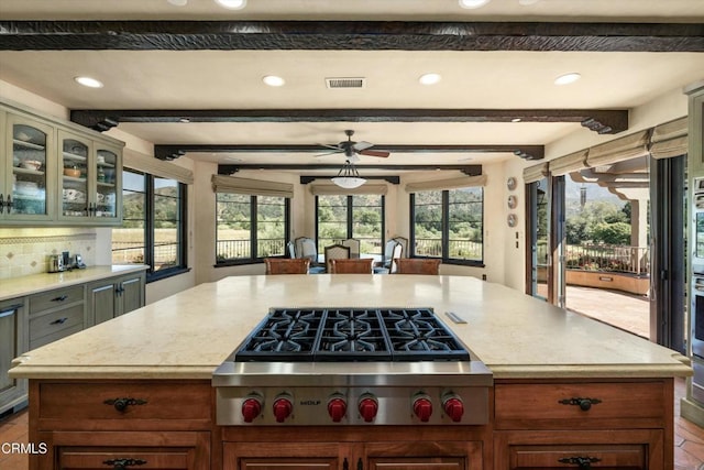 561 Saddle Ln, Ojai, CA 93023 - kitchen with stainless steel appliances, backsplash, beamed ceiling, and visible vents