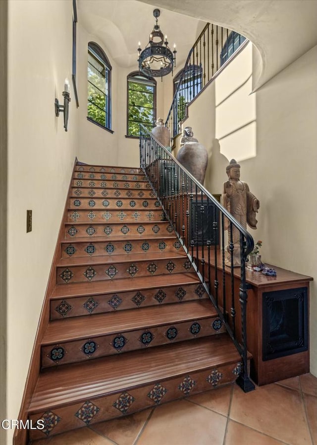 561 Saddle Ln, Ojai, CA 93023 - stairs with an inviting chandelier and tile patterned flooring