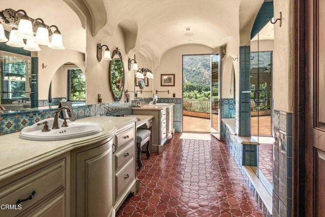 561 Saddle Ln, Ojai, CA 93023 - bathroom featuring a washtub, two vanities, and a sink