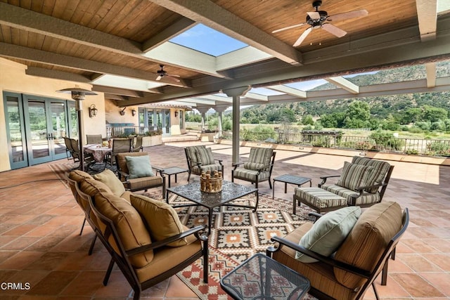 561 Saddle Ln, Ojai, CA 93023 - view of patio with ceiling fan, fence, outdoor lounge area, and french doors
