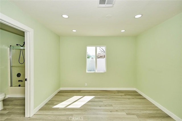 unfurnished bedroom featuring light wood-type flooring, baseboards, visible vents, and recessed lighting