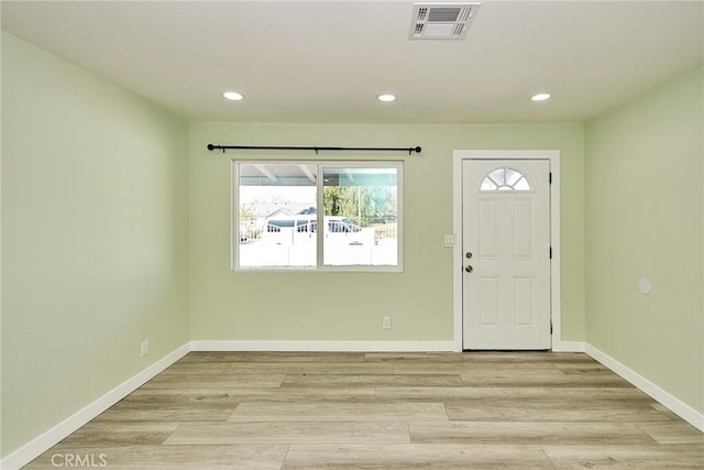 foyer entrance featuring recessed lighting, plenty of natural light, and visible vents