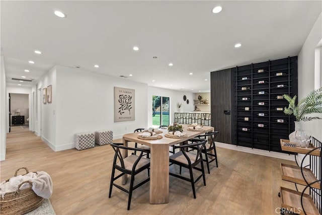dining area with recessed lighting, light wood finished floors, and baseboards