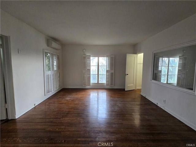 1958 Glencoe Way, Los Angeles, CA 90068 - interior space featuring baseboards, a wall unit AC, and dark wood-style floors
