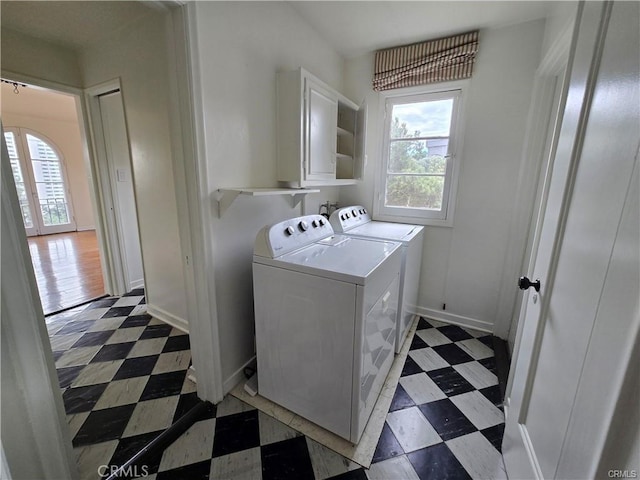 1958 Glencoe Way, Los Angeles, CA 90068 - laundry area with independent washer and dryer, a wealth of natural light, tile patterned floors, and baseboards