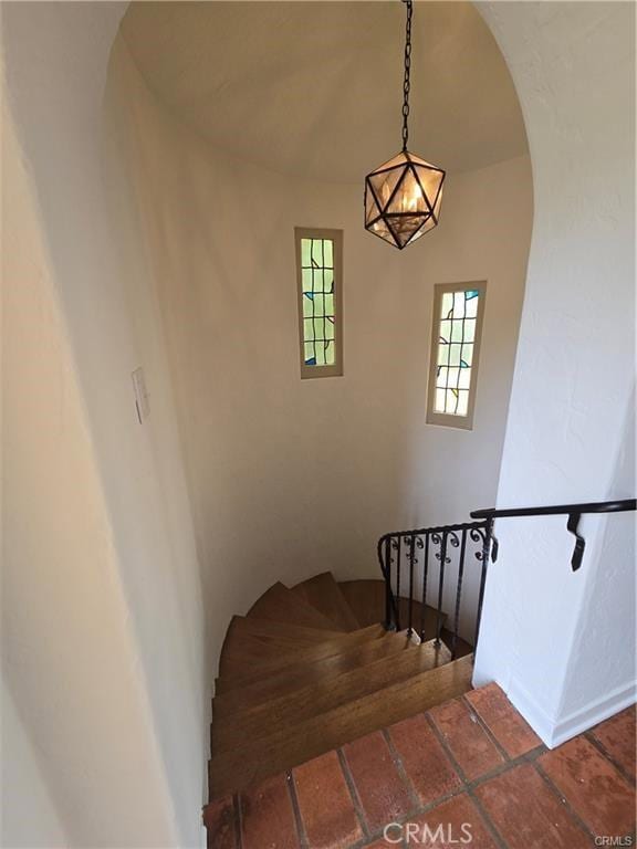 1958 Glencoe Way, Los Angeles, CA 90068 - staircase with baseboards and arched walkways