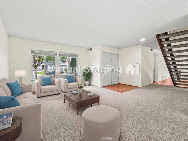 25582 Old Course Way, Valencia, CA 91355 - living room with carpet, french doors, a textured ceiling, and recessed lighting