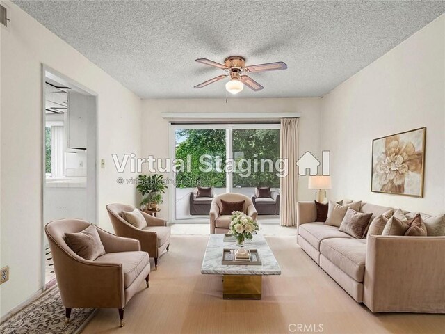 25582 Old Course Way, Valencia, CA 91355 - living area with ceiling fan and a textured ceiling