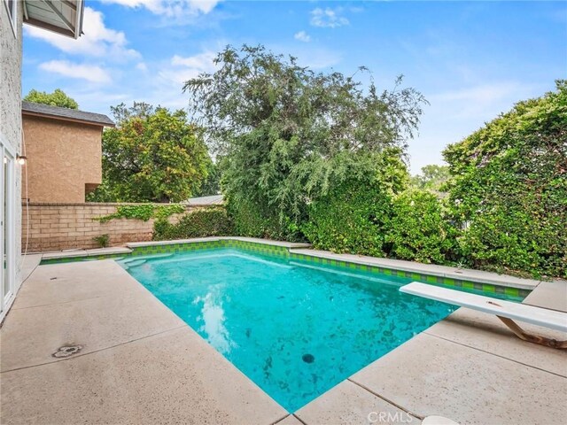 25582 Old Course Way, Valencia, CA 91355 - view of swimming pool with a patio area, a diving board, and a fenced backyard