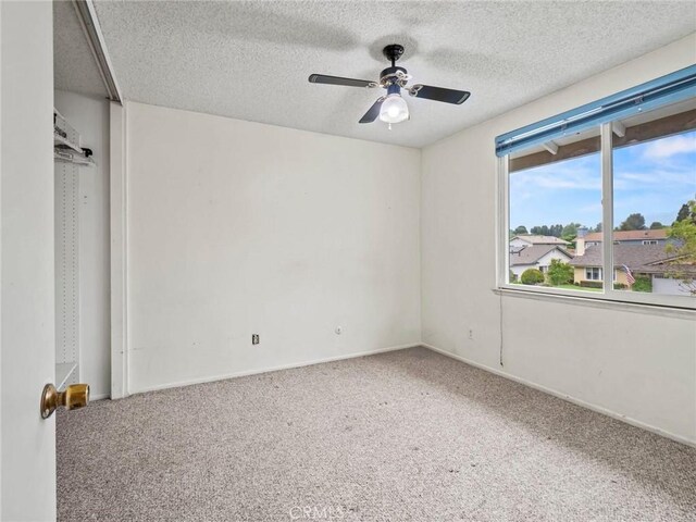 25582 Old Course Way, Valencia, CA 91355 - carpeted spare room with ceiling fan and a textured ceiling