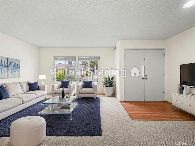 25582 Old Course Way, Valencia, CA 91355 - living area featuring a textured ceiling and carpet