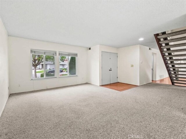 25582 Old Course Way, Valencia, CA 91355 - unfurnished living room with carpet floors