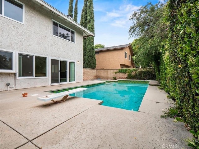 25582 Old Course Way, Valencia, CA 91355 - view of swimming pool featuring a patio, a diving board, and a fenced backyard