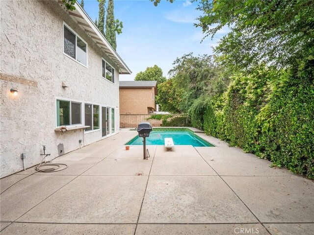 25582 Old Course Way, Valencia, CA 91355 - view of swimming pool featuring a patio area and a diving board