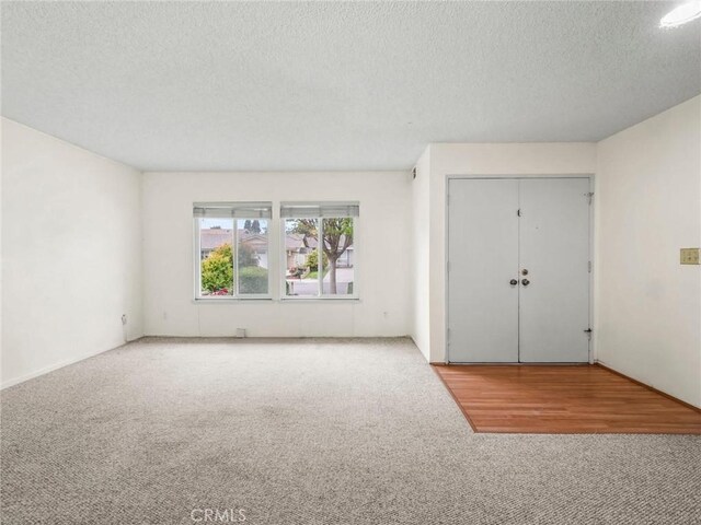 25582 Old Course Way, Valencia, CA 91355 - carpeted foyer entrance with a textured ceiling
