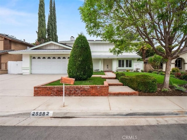 25582 Old Course Way, Valencia, CA 91355 - view of front facade featuring an attached garage and driveway