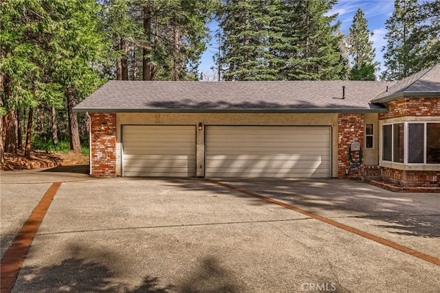 garage featuring driveway