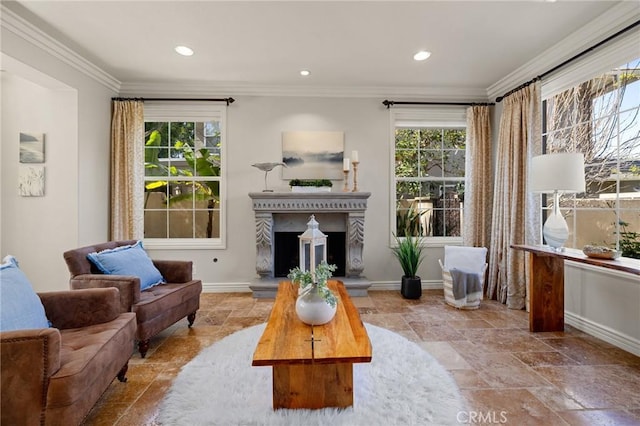 living room with baseboards, ornamental molding, recessed lighting, a fireplace with raised hearth, and stone tile floors
