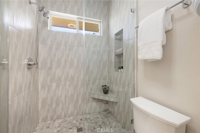 full bath featuring toilet and a stall shower
