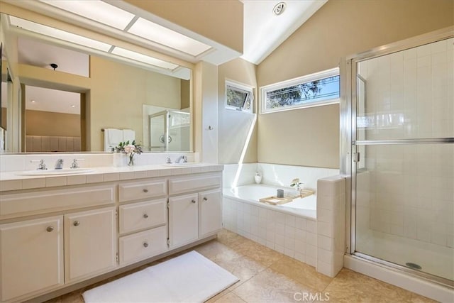 4 Bastia, Laguna Niguel, CA 92677 - bathroom with lofted ceiling, a shower stall, a sink, double vanity, and a garden tub