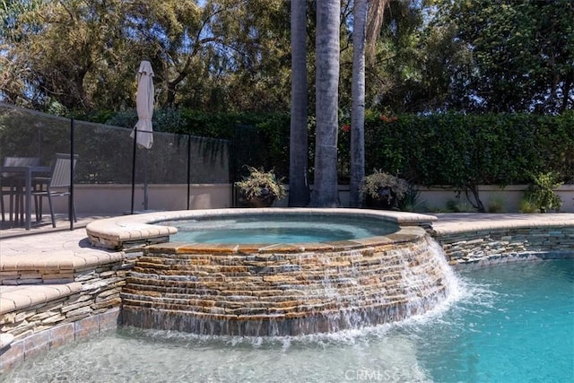 4 Bastia, Laguna Niguel, CA 92677 - view of pool featuring fence and a pool with connected hot tub