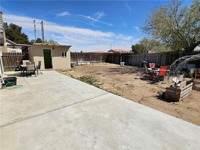 12261 Stonegate Cir, Victorville, CA 92392 - fenced backyard featuring a patio and outdoor dining area