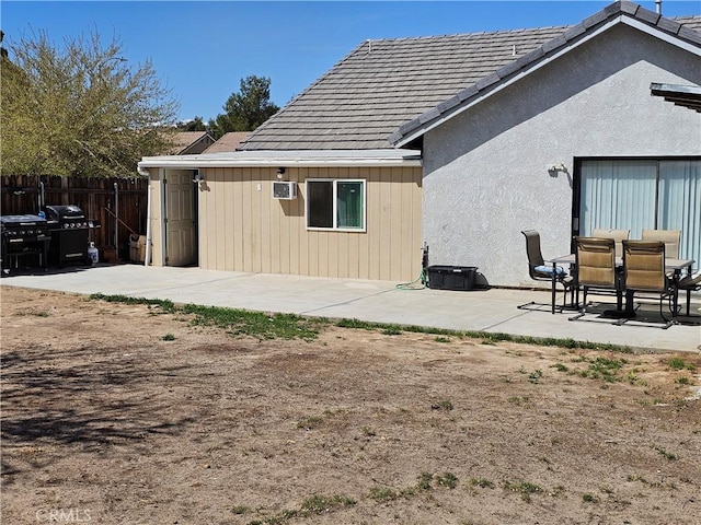 12261 Stonegate Cir, Victorville, CA 92392 - back of house featuring a patio and a tile roof