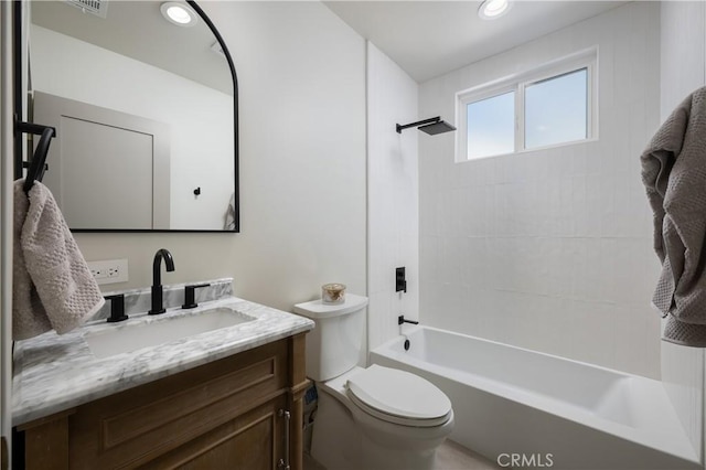full bath with vanity, recessed lighting, washtub / shower combination, and toilet