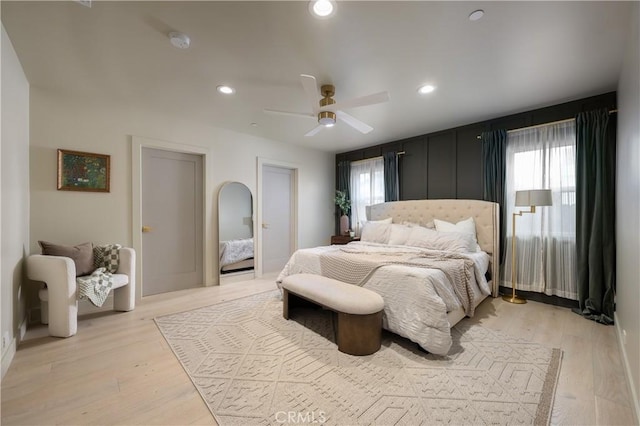 bedroom with ceiling fan, recessed lighting, and light wood-type flooring