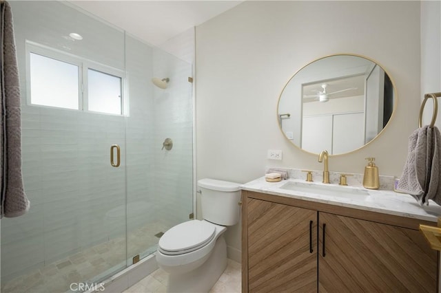 full bathroom featuring vanity, toilet, and a stall shower