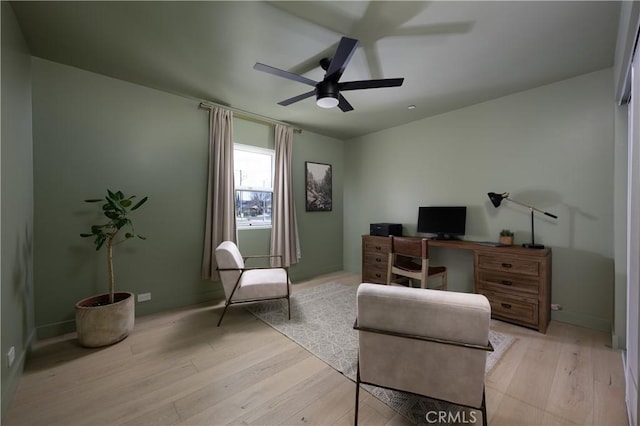 home office featuring a ceiling fan and light wood finished floors