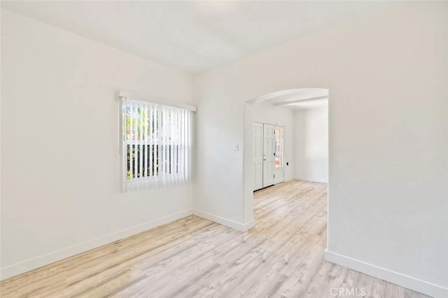 2200 Chestnut, Long Beach, CA 90806 - unfurnished room with arched walkways and wood finished floors