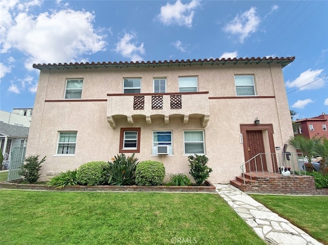 2200 Chestnut, Long Beach, CA 90806 - mediterranean / spanish home with stucco siding, a front lawn, and cooling unit