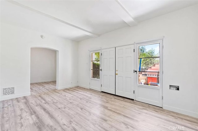 2200 Chestnut, Long Beach, CA 90806 - entrance foyer featuring beam ceiling, plenty of natural light, wood finished floors, and arched walkways