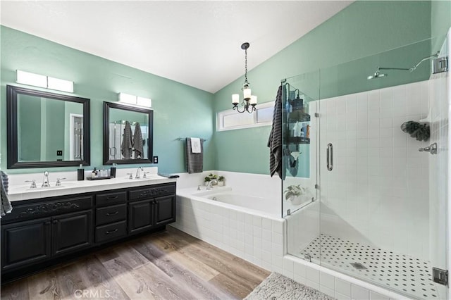 22004 Pamplico Dr, Saugus, CA 91350 - full bathroom featuring a garden tub, a shower stall, wood finished floors, lofted ceiling, and double vanity