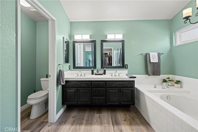22004 Pamplico Dr, Saugus, CA 91350 - full bath featuring a sink, toilet, wood finished floors, and a garden tub