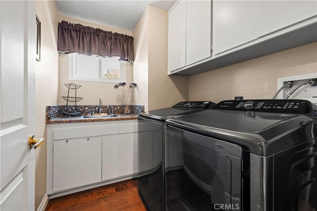 22004 Pamplico Dr, Saugus, CA 91350 - laundry room featuring dark wood-type flooring, separate washer and dryer, wet bar, a sink, and cabinet space