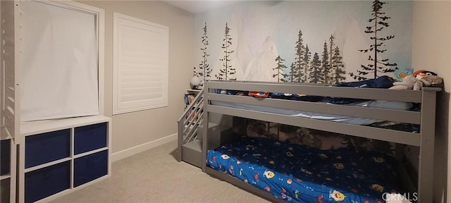bedroom featuring carpet floors and baseboards