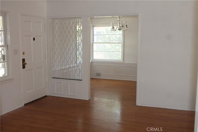 427 S Mariposa St, Burbank, CA 91506 - entrance foyer with a chandelier, wood finished floors, and healthy amount of natural light
