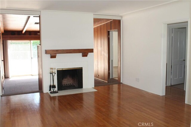 427 S Mariposa St, Burbank, CA 91506 - unfurnished living room with wood finished floors, a fireplace with flush hearth, and beam ceiling