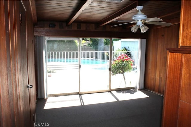 427 S Mariposa St, Burbank, CA 91506 - doorway featuring wood walls, ceiling fan, carpet, and wooden ceiling with exposed beams