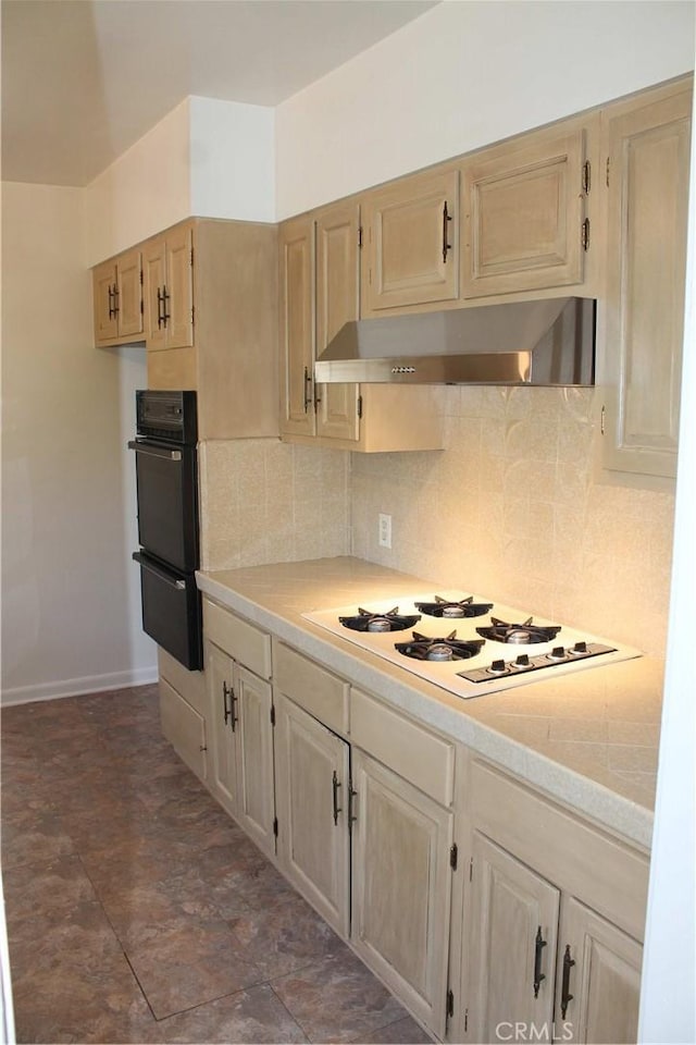 427 S Mariposa St, Burbank, CA 91506 - kitchen with under cabinet range hood, white gas stovetop, light countertops, and backsplash