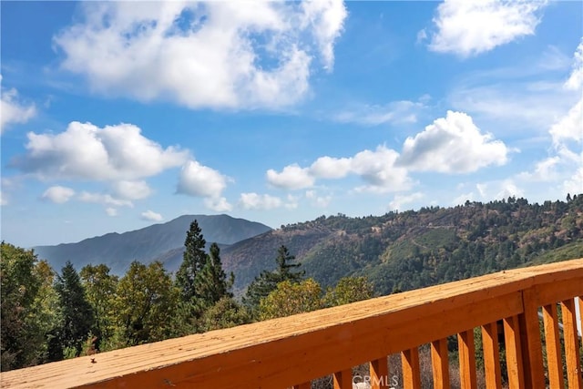 2745 Deer Creek Dr, Running Springs, CA 92382 - view of mountain backdrop with a forest