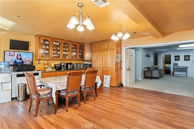 2745 Deer Creek Dr, Running Springs, CA 92382 - dining room with a chandelier, light wood finished floors, and beamed ceiling