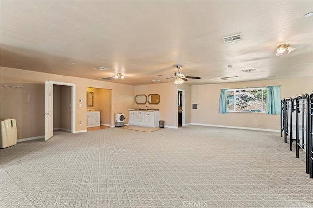 2745 Deer Creek Dr, Running Springs, CA 92382 - unfurnished living room featuring light colored carpet, ceiling fan, and a textured ceiling