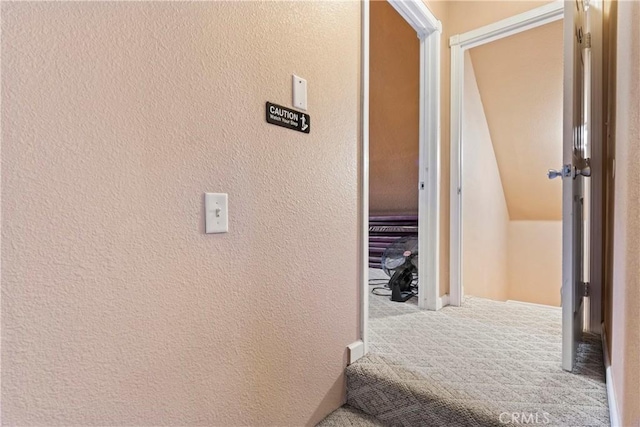 2745 Deer Creek Dr, Running Springs, CA 92382 - corridor with carpet floors and a textured wall